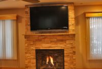 gas fireplace with stone surround Gas fireplace with stone surround stock photos