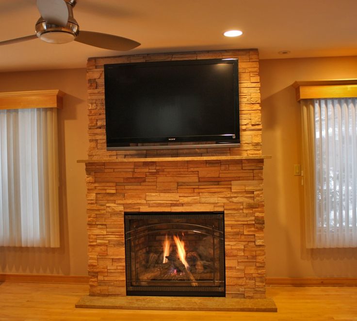 gas fireplace with stone surround Gas fireplace with stone surround stock photos