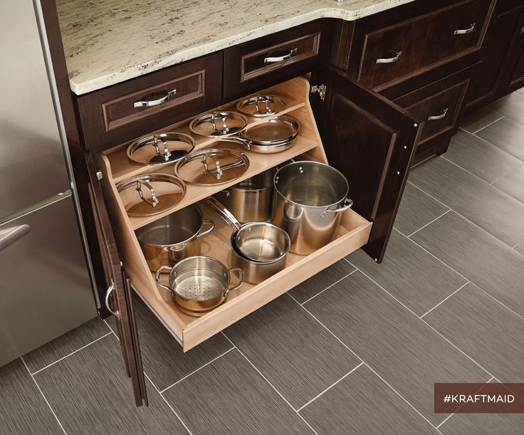 A pots and pans organizer provides easy access to large pots and pans