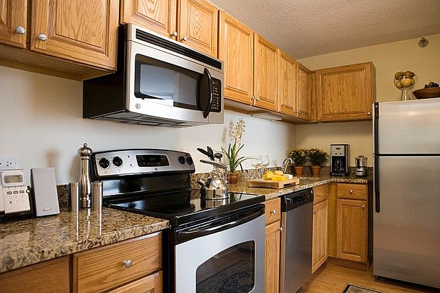 granite countertops with oak cabinets Oak cabinets countertops granite kitchen countertop cabinet honey colors read kitchens