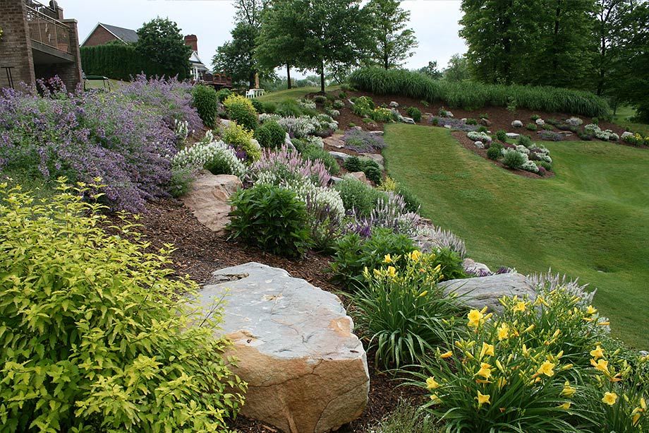 Landscaping Hillside with Big Rocks Landscaping hillside rock landscape beautiful boulders rocks perennials shrubs garden backyard tiered terraced sloped hill don know lawn choose board