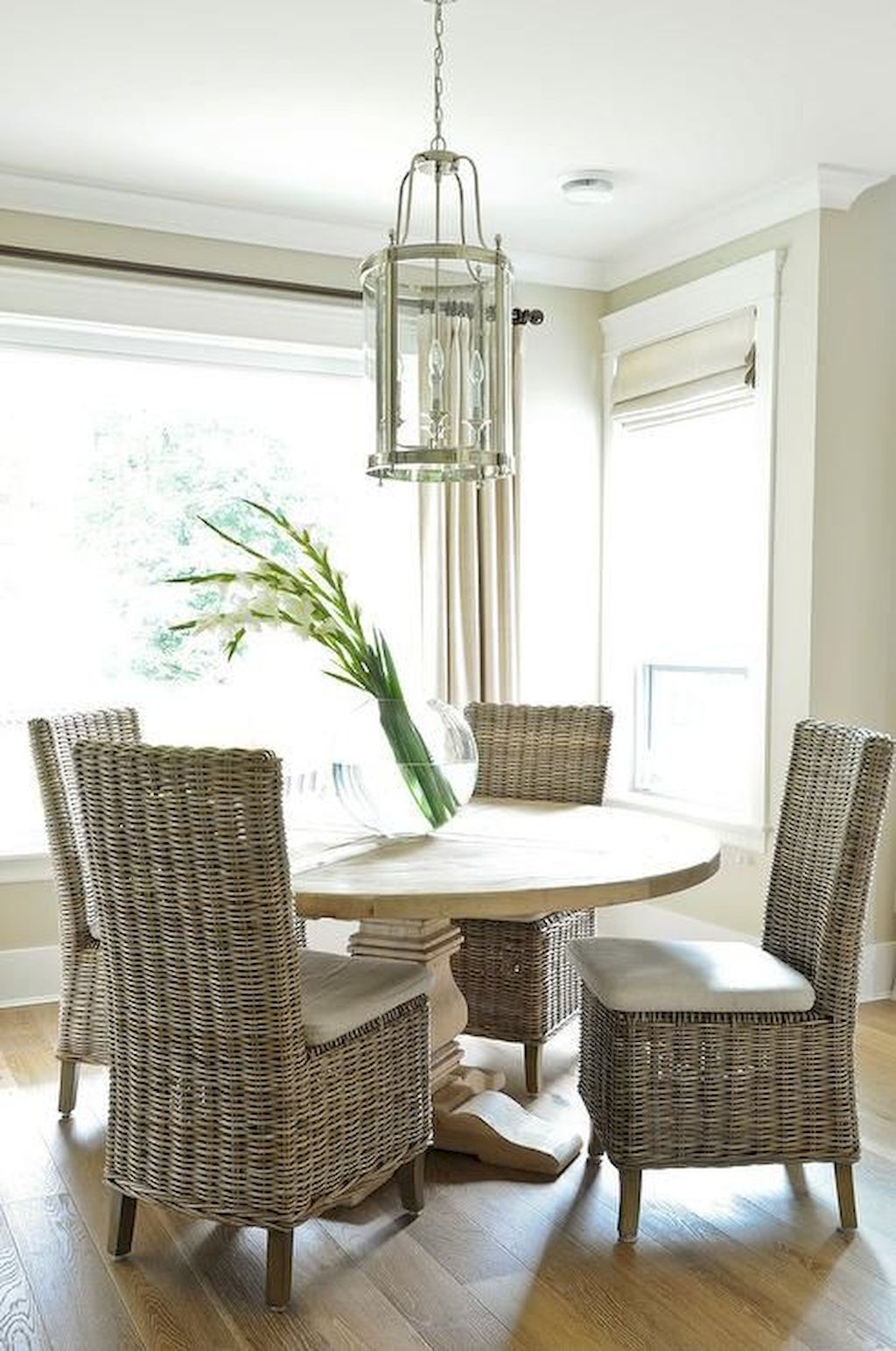 Dining Table with Wicker Chairs Dining table chairs wicker round wood room salvaged transitional designs kitchen interior lantern nickel nook glass chair window decoration rooms