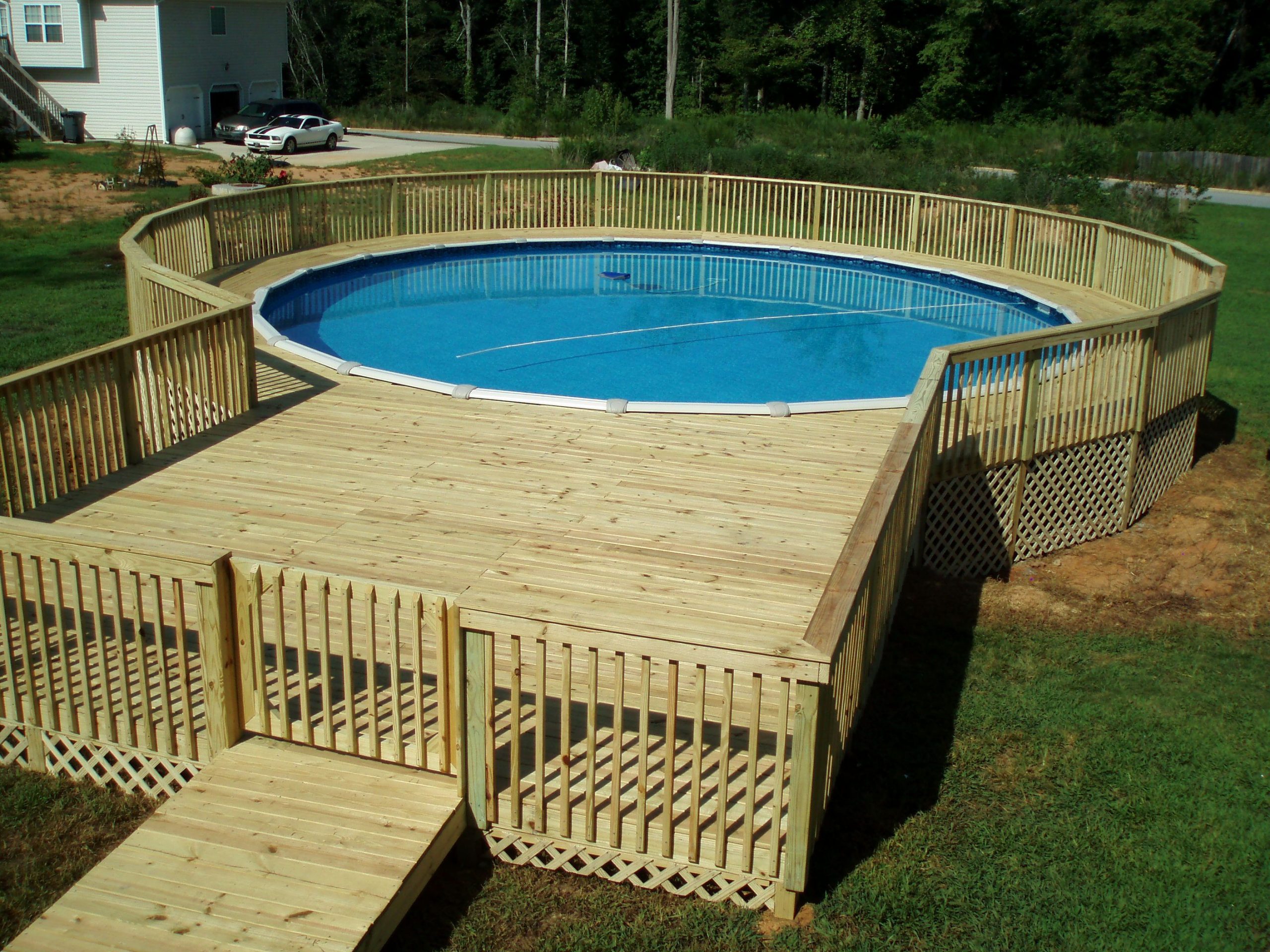 how to build an above ground swimming pool Ground pool above landscaping pools around deck inground swimming hill backyard decks installation designs putting small prices diy built budget