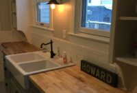 butcher block countertop with farmhouse sink Farmhouse countertops sinks cabinets cottage composite undermount apron techolac beadboard drool thespruce granite