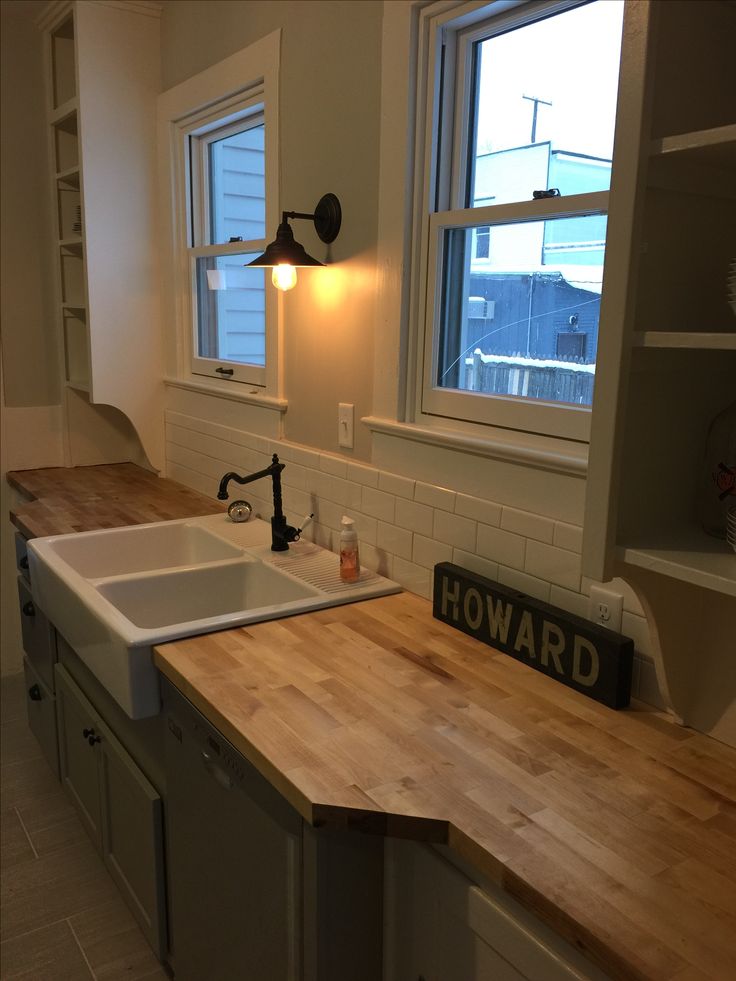 butcher block countertop with farmhouse sink Farmhouse countertops sinks cabinets cottage composite undermount apron techolac beadboard drool thespruce granite